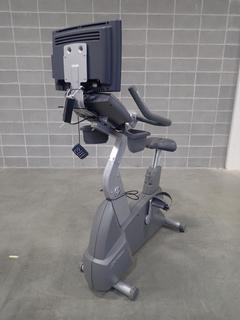Life Fitness Upright Bike w/ HDTV Monitor. SN CLU102320 *Note: Missing 1 Pedal, This Item Is Located At 7103 68AVE NW- Location 2*