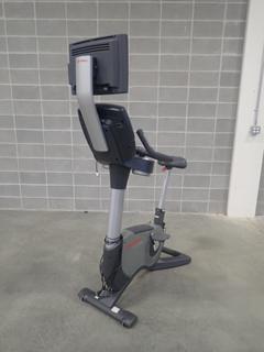 Life Fitness 95C Lifecycle Upright Bike w/ HDTV Monitor. SN ALX103717 *Note: Plastic Broke On Back, This Item Is Located At 7103 68AVE NW- Location 2*