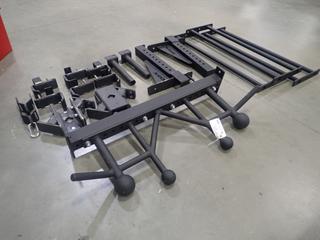 Qty Of Assorted Rogue Rig Bars Includes: Chin Up Bar, Bar Racks And Plate Holders *Note: This Item Is Located At 7103 68AVE NW- Location 2*