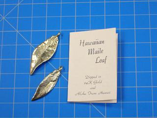 (2) Hawaiian Maile Leaf Dipped In 24K Gold, Can Be Worn As A Pendant, Size *Note: Unable to Verify Authenticity* (Office)