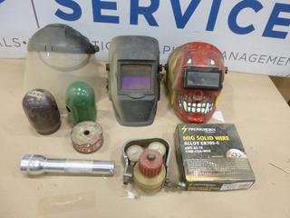 Qty of Welding Supplies Including Roll of Mig Wire, (2) Welding Helmets, Face Shield, Acetylene Gauge, Flashlight and Bottle Caps (F2)