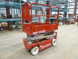 2009 MEC 1932ES Scissor Lift c/w 24V, Showing 41 Hours, 500 Lbs Capacity, 19 Ft. Platform Height, 5 1/2 Ft. Platform, 3 Ft. Extension, 2 People Capacity *Note: Unit Operates And Functions, Batteries Need To Be Replaced (Weak)*