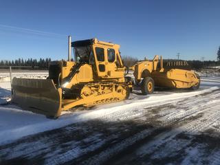 1992 Cat D7G Showing 1949 Hrs c/w Heated and A/C Cab (A/C Need Repair), Rear Window Guard, Angle Dozer, 144 In. Blade, 26 In. Pads, SBG, Carco Winch, Draw Bar, SN 65V07668 c/w Cat 435F Hydraulic Pull Scraper, SN 2J8309 *Located Off Site, For More Information Contact Richard at 780-222-8309*