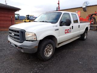 2006 Ford F350 Crew Cab Super Duty XL Pickup Truck C/w 5.4L, 3V Triton Gas Engine, 8-Cylinder A/T And Aluminum Headache Rack. Showing 180,722kms. VIN 1FTWW315X6EB05189 *Note: Drivers Seat Torn, Back Seat Soiled, Front Bumper Damaged*