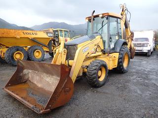 2003 John Deere 710G Backhoe Loader C/w Stanley V65 Hydraulic Control Valve, JRB Model 710G Bucket, 2 Yard Capacity, Sn 90D0981-DW, ROPS And Delco Electronics Radio. Showing 6279hrs. SN T0710GX918371