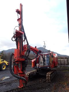 2013 Sandvik Excavator w/ Mounted Hydraulic Rock Drill, Model DX800 C/w Track Type Carrier, 12in Single Grouser Pads, CAT 4.4 Drive Motor, 3in ‐5in Holding Cap, 1 3/4in And 2in Rod Cap, HL810T Drill Head, Brigade BE-870FM Backeye Quad View Backup Camera System, U/C 70% And 2013 Dust Collection System, DC810H, SN C021318. Showing 3215hrs. SN 113T26249‐1