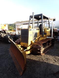 1990 John Deere 650G Crawler Dozer C/w 6-way Angle Blade, AROP, 20in Single Grouser Pads, 10ft Blade, Light Package And U/C @ 30%. Showing 7587hrs. PIN T0650GW765852