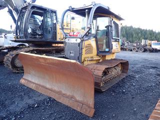 2012 John Deere 650J LGP Crawler Dozer C/w 27 1/2in Double Grouser Pads, Cab, Sweeps, ROPS, Light Package, Brush Guards, Ice Breakers, 129in Blade, John Deere Winch, Sn T04000x007932, Delphi Radio And U/C 30%. Showing 6059hrs. SN 1T0650JXPCD234057