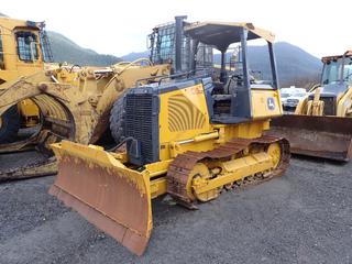 2005 John Deere 450J LT Crawler Dozer C/w Open Cab, Power Tech 4.5L JD Engine, 15 1/2in Single Grouser Pads, 8ft 6-Way Front Blade And ROPS. Showing 2512hrs. SN T0450JX112851