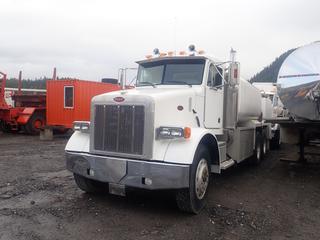 2002 Peterbilt 357 T/A Fuel/Lube/Service Truck  C/w 6x4 Drive, Cat Engine, 18-Speed Transmission, Customized Deck Unit, Reel Compartment, 75 Gallon Aluminum Fuel Tank With  Pump, Lock Boxes On And Under Deck, Tires @ 80%, 14,000 Lb. Front Axle, 40,000 Lg. Rear Axle And Aluminum Wheels. Showing 5584hrs, 005,231 Miles. VIN 1NPALU9X52D575248