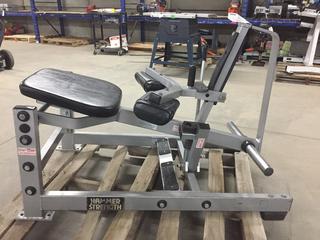 Hammer Strength Plate Loaded Seated Calf Machine.
