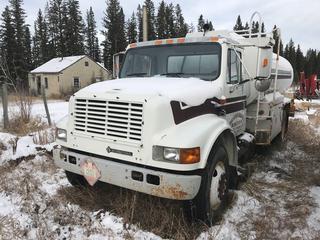 Selling Off-Site -  1999 International 4700 S/A Fuel Truck c/w 7.6L Diesel, International 7 Spd, PTO, Pump, Hose Reel, Ticket Printer, 2100 Gal Tank, 11R22.5 Tires, Showing 127,720 Kms, VIN 1HTSCAAP1XH593593. Located at Sundre, AB., Viewing By Appointment Contact Graham to Arrange Viewing 403-968-7697.