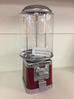 Northern Beaver Gumball Machine (Red). Approximately 18"H x 7"L. *Note: Keys For This Machine Are In Office