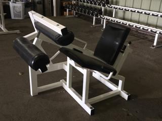 Lever Seated Leg Curl.