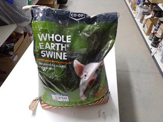 Bag of Whole Earth Swine Feed.