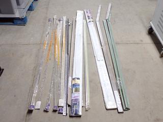 (2) Galvanized Slotted Steel Angle, (3) Stair Nosing, Damaged, (2) Garage Door Jambs & T-Moldings.