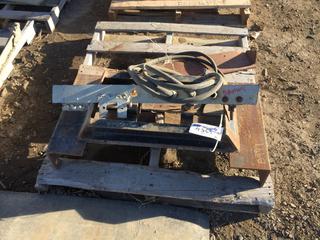 Steel Frame with Hydraulic Hoses.