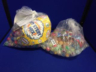 (2) Bags of Miniature Mystery Mix Toys In Capsules.