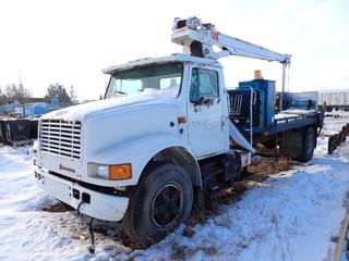 1998 International 4700 S/A Picker Truck C/w International A-210 Diesel Engine, 6 Speed Transmission, 15ft 10in X 8ft Deck, Pitman Model HL95M Hydra Lift, 3-Stage Picker (2) Storage Boxes, (2) Outriggers And 11R22.5 Tires. Showing 11,261hrs, 239,825kms. VIN 1HTSCAAP0WH498411 *Note: Cracks In Windshield, Front Passenger Light Missing, Deck Requires Repairs, No Keys, Driveshaft Located On Deck, Running Condition Unknown*