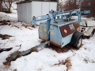 2004 Genie TML S/A Tow Behing Light Tower C/w Diesel Engine And 2 5/16 Ball Hitch. Showing 09615hrs. VIN 5D8LC14154R000262 *Note: No Lights, (2) Flat Tires, Running Condition Unknown, Located Offsite*