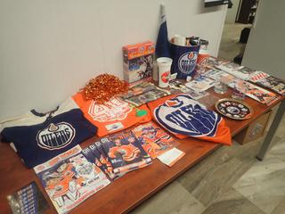 Qty Of Assorted Oilers Memorabilia Includes: Flags, Shirts, Cards, Jersey, Puck, Programs And Hat 