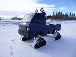 1992 Mitsubishi Minicab 4X4 ATV c/w Mitsubishi 3G83 657cc, 4 Speed Manual, Showing 58,667 Kms, 11 In. Mattracks, Right Hand Drive w/ Set of (4) Tires, S/N U42T0107954 *Note: Passenger Side Mirror Damage* 