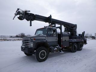 1986 International F1954 w/ Telelect Commander 5000 Digger Derrick Truck c/w DT466 Diesel Engine, Eaton Fuller 13 Speed Transmission, Showing 153,336 Miles, Webasto Heater, Tekonsha Trailer Brake, PTO, 192 In. W/B, Day Cab, Hendrickson Spring Over Beam Suspension, 7 Ft. Body, Pole Clamp Winch, 4 Hydraulic Outriggers, Hose Reels, No Auger, 1100/22.5 Tires, VIN 1HTLKTVR9GHA56889 