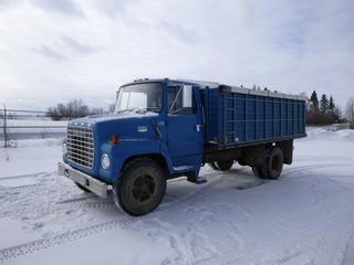 1976 Ford 750 Grain Truck c/w 10 Speed Manual, Showing 35,361 Miles, PTO, GVWR 23,000 Lbs, 184 In. W/B, Spring Suspension, 9.00-20 Front Tires at 5%, Rears are 15%, Manual Tarp, New Battery, 16 Ft. Box, SN N75EVC10550