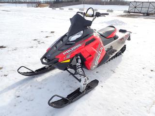 2014 Polaris Switchback Assault 800 Snowmobile C/w 144in Track, 40in Skis, Walker Evans Shocks And Cover. Showing 57hrs, 1950kms. VIN SN1CL8GS4EC009295