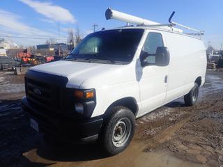 2012 Ford E-150 Van C/w 4.6L Flex Fuel Gas Engine, A/T, Prime Design Roof Rack, Galvanized Steel Shelving And LT225/75 R16 Tires. Showing 266,251Kms. VIN 1FTNE1EW8CDA74676 *Note: Windshield Damaged*