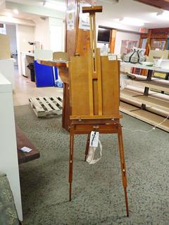 Easel. *Note: Broken, Difficult to Stand.* Approximately 5 Ft.