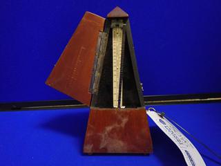 Metronome. *Note: Broken, Requires Repair.*