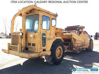 High River Location -  1976 Cat 613 Elevating Motor Scraper c/w 23.5-25 Tires, S/N 71M3852 Rear S/N 72M3852, (2) Extra Tires. *Note: Not Running, Requires Repair.*