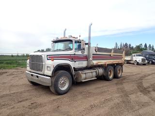 1990 Ford L9000 Dump Truck c/w Cat Engine, 18 Speed Eaton Fuller, A/C, PTO, Storage Cabinet, GVWR 22,679 KG, 11R24.5 Tires, 204 In. W/B, Diff-Lock, Spring Susp, Front Axle Rating 6,377 KG, Rear Axle Rating 20,464 KG, Hydraulic Dump, Manual End Gate, Showing 899,999 Kms, 97,787 Hrs, VIN 1FDYU90X5LVA17128 *Note: Damage to Hood*