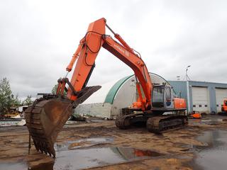 1998 Hitachi EX330LC-5 Excavator c/w Isuzu Diesel, 41 1/2 In. Digging Bucket, 31 1/2 In. Tracks, TBG, 10 Ft. 6 In. Stick, Thumb, Showing 12,412 Hrs, SN 1H1P020609 *Note: Broken Window* **Located Offsite In Edmonton, For More Information Contact Richard 780-222-8309**