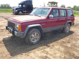 1990 Jeep Cherokee 4X4 SUV c/w 4.0L, A/T, A/C, P215/75R15 Tires, Showing 401,547 Kms, VIN 1J4FJ58LXLL245288 *Note: Cannot Open Hood, Cable Seized, Damage*