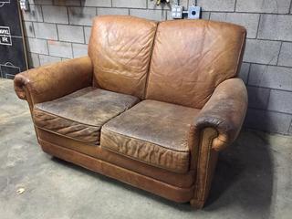 Leather Loveseat with Nailhead Trim.