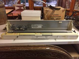 1980's Knitting Machine w/ (2) Boxes of Knitting Machine Book Papers & VHS Tape, Knitting Machine Parts, Knitting Machine Stand.