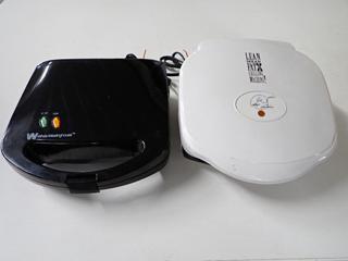 (1) White - Westinghouse Sandwich Maker and (1) George Foreman Grill.