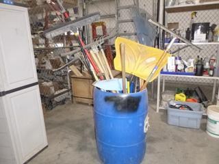 Bin Of Brooms, Shovels, Rakes And Ice Chippers