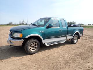 1997 Ford F-150 XLT Extended Cab Pickup c/w V-8 (Incomplete Engine), A/C, LT45/75R16 Tires at 55%, 6 Ft. Box, Engine Parts and Radiator In Back Seat, Showing 359,253 Kms, VIN 2FTDX18W4VCA87512 *Note: Salvage Title, Damage to Front Passenger Side and Hood*