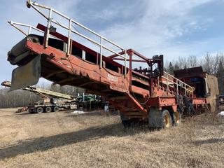 Located Offsite - 1973 Pioneer Tandem Axle Feeder, 48 Ft. X 42 In. Belt Discharge Conveyors, 10x14 Ft. Grizzly, 10 Ft. x 36 In. Feed Conveyor, 460V, 25 HP WEG Feeder Motor, 80 In. Rock Kicker, 10 HP Electric Motor, 25 HP Discharge Conveyor Motor, Heated Feeder Bin, Cable Package, Adjustable Incline  *Note: Buyer Responsible For Load Out*   **Major Equipment Dispersal For Skoreyko Crushing Ltd.**   Located Near Caslan, AB  For More Info Contact Connor @ 780-218-4493