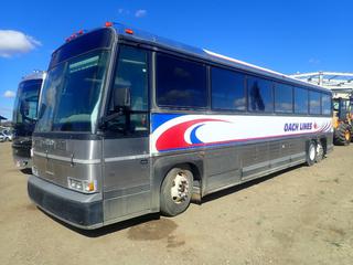 1993 Motor Coach Industries 102-C3 40 Ft. T/A 47-Passenger Bus c/w Detroit Diesel, 5 Speed, 24V Start, Onboard Bathroom, Overhead Storage Compartments, (3) Bottom Storage Compartments w/ Access On Both Sides, GVWR 40,000 Lb., 12R22.5 Tires, GAWR 14,400 Lb. Fronts, GAWR 7,500 Lb. Rears, Showing 1,096,218 Kms, VIN 1M8GDM9A7PP045395 *Note: Boost To Start, Driver Side Windshield Cracked, Brake Pedal Sticks, A/C Does Not Work*