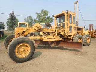 1974 Caterpillar 120 Motor Grader c/w Caterpillar 3306 Diesel Engine, 6 Speed Manual, Enclosed Cab, Heater, 14 Ft. Mold Board 14.00-24 Tires, SN 22R1060 *Note: Damage to Windshield* **Located Offsite at 21220-107 Avenue NW, Edmonton, For More Information Contact Richard at 780-222-8309** (PL 0973)