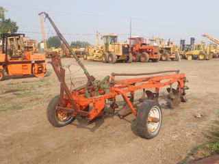 Antique 4 Bottom Pull Type Plow c/w (4) 21.5 In. Blades, 12.5 4 PLY Front Tire (Flat), F78/15 Rear Tires (Cracked) **Located Offsite at 21220-107 Avenue NW, Edmonton, For More Information Contact Richard at 780-222-8309** (PL 0974)