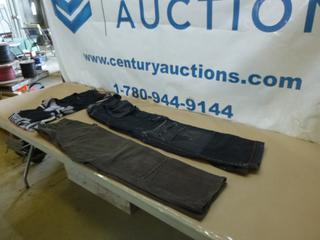 (1) Helly Hansen Work Pants, (1) Carhartt Work Pants, (1) Nike Shirt, Size Large, (1) Reebok Jersey, Size Small (G1)