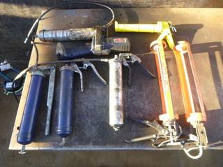 (1) Lincoln Cordless Grease Gun *Note: Battery Missing*, (3) Caulking Guns, (3) Grease Guns  (OS)