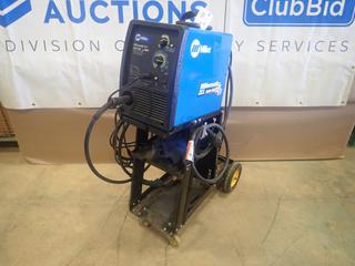 Miller Millermatic 211 120/230V Single Phase MIG Welder C/w Miller MIG Gun, Smith Gas Regulator, Ground Cable, Cart And Cover. SN MB101449N (N-1-3)