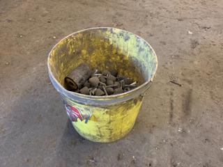 Pail of Assorted Grinding Stones