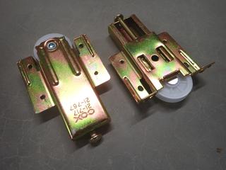 (2) Boxes of COX Bottom Roller Axle Protruding Wheel Bypassing Door Hardware, No. 21-717, 25 Pairs Per Box.